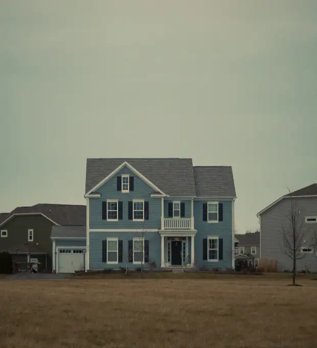 A two-story suburban home photographed on a clear day